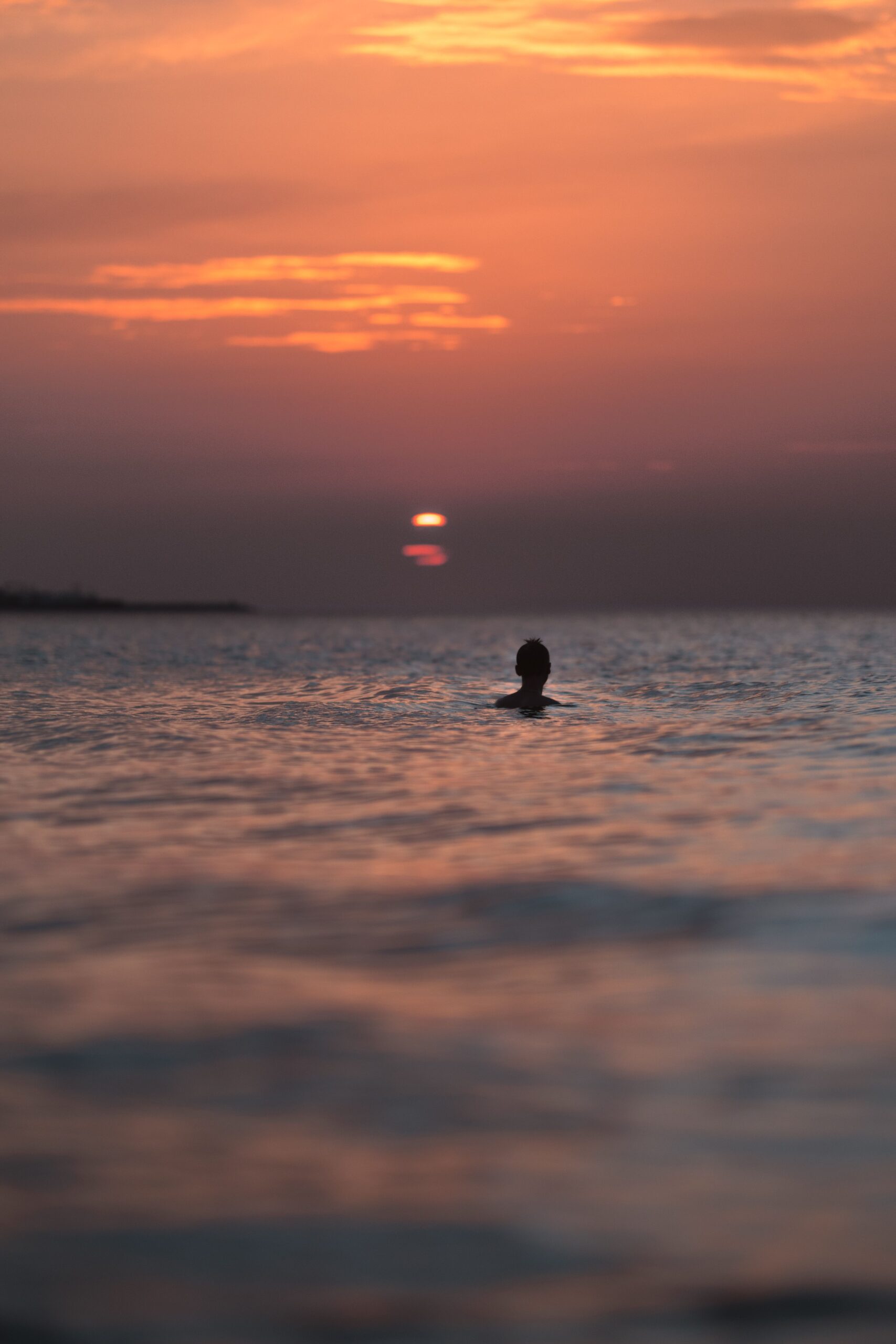 guy swimming in the sea of cortez nocturnal snorkeling
